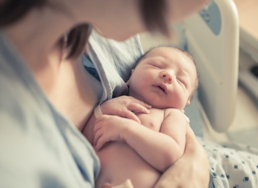 mother holding newborn