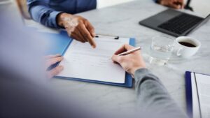 Lawyer Showing a Document with Another Lawyer