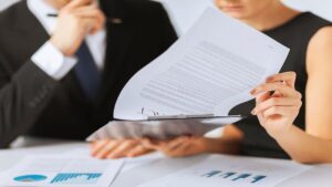 A Female and Male Lawyers Reading a Document 