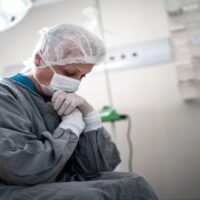 Man and Woman in the Operating Room in Hospital