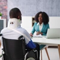 Man with Wheelchair Seeking Consultation to a Lawyer